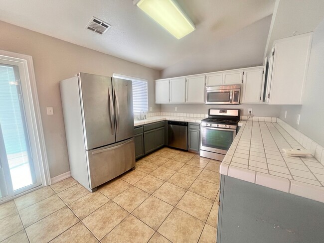 Photo - Charming 3-bed 2-bath home with a pool & pool service included!