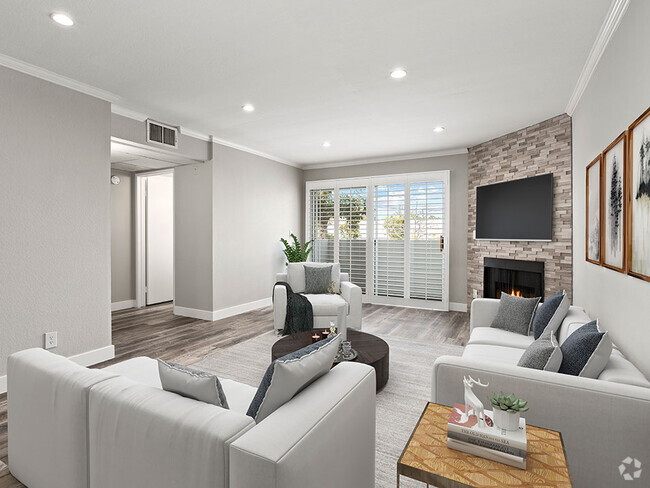 Hardwood floored living room with stone accented fireplace. - Magnolia Terrace Rental