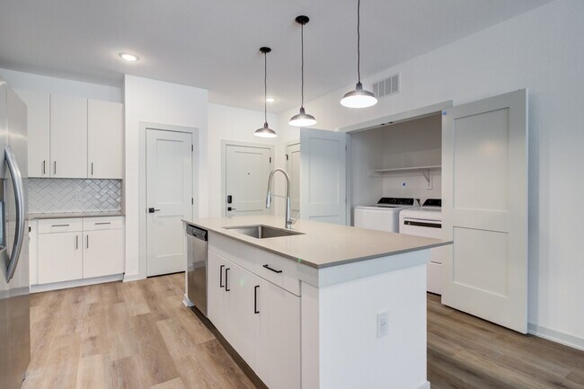 A stainless steel dishwasher, modern finishes, and full-size washer and dryer can be expected in every Garrett Forum apartment. - Garrett Forum