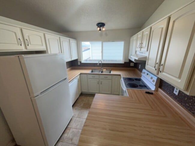 Photo - Beautiful ranch style home that has a finished basement and stunning views from the front deck!