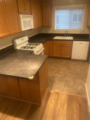 Photo - LIKE NEW three bedroom with fantastic updates, one car garage and private newly fenced front patio!