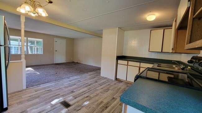 Photo - Freshly painted spacious 2-bedroom 1-bath home with a screened porch and storage shed.