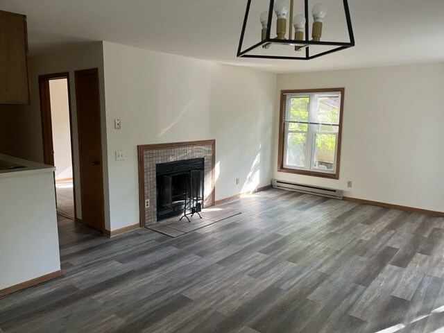 living room with fireplace - 4933 Mineral Point Rd Apartments Unit 4