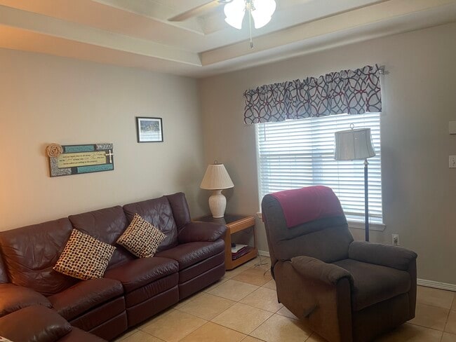 Living Room window and Recliner - 2607 Ringold Cir Unit B Furnished Apt