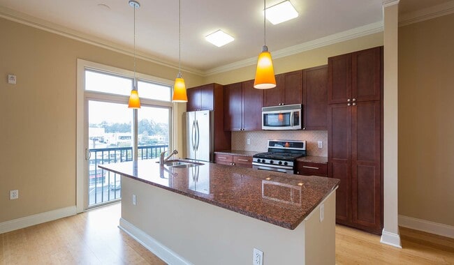 Stainless steel appliances and granites countertops in designer kitchen