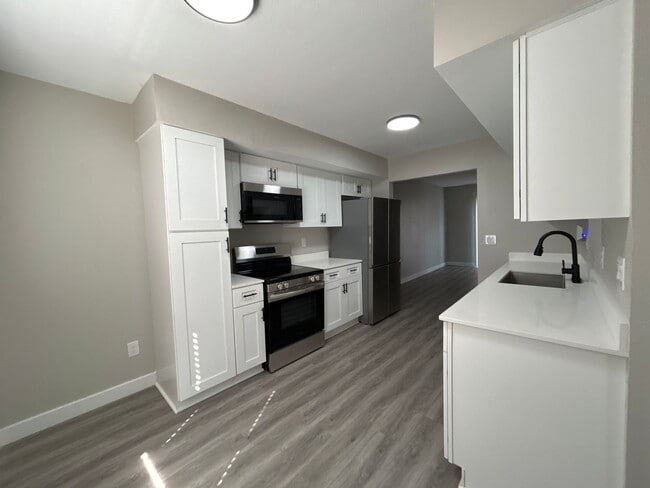 Photo - Beautifully Redone 3-Bedroom, 1.5-Bathroom Condo with Attached Garage – $1,725/Month (Lawn Care &...