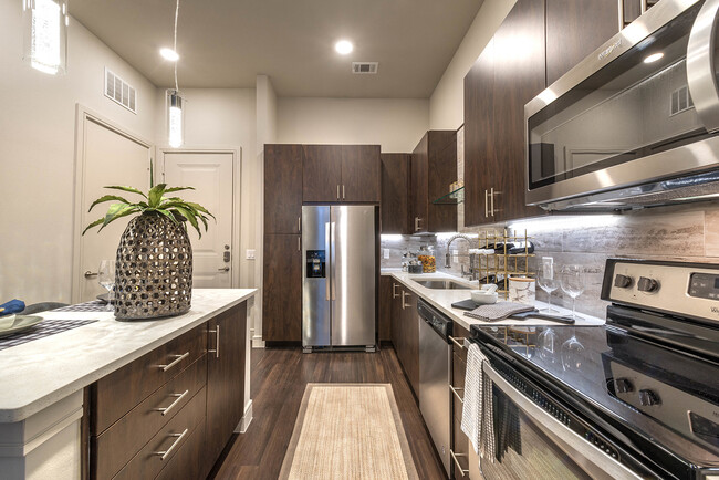 Our modern kitchens are designed with the home chef in mind, featuring stainless steel appliances - Windsor Turtle Creek Apartments