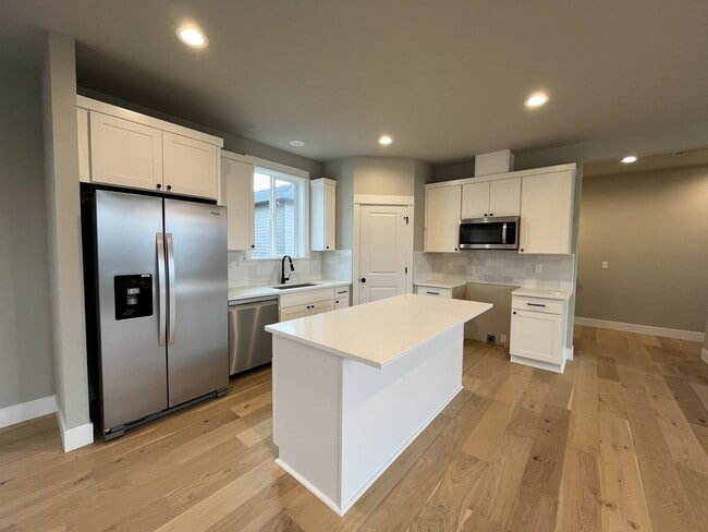 Photo - Brand New Spacious and Light-Filled Condo Offering an Open Layout, Island Kitchen, and Outdoor Deck