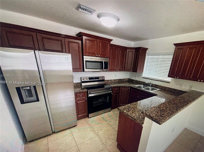 Building Photo - 5881 NW 32nd Ave Rental