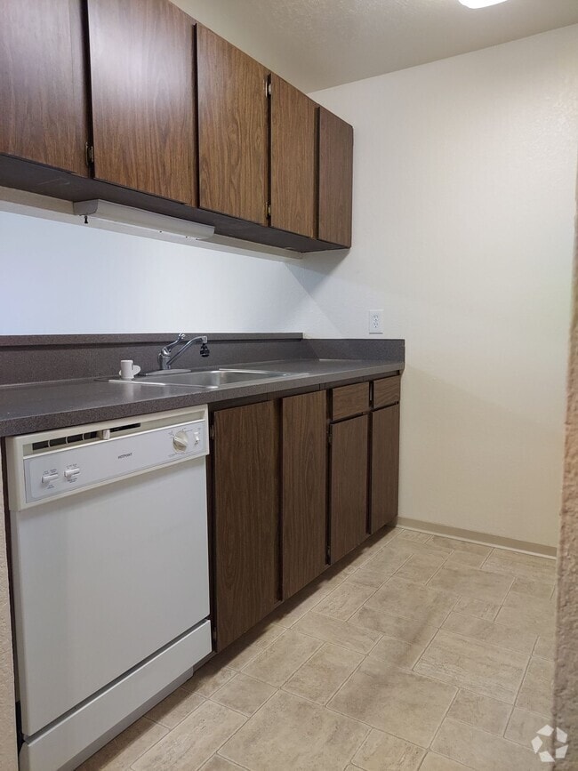 Kitchen open to living room - Pinehurst Apartments