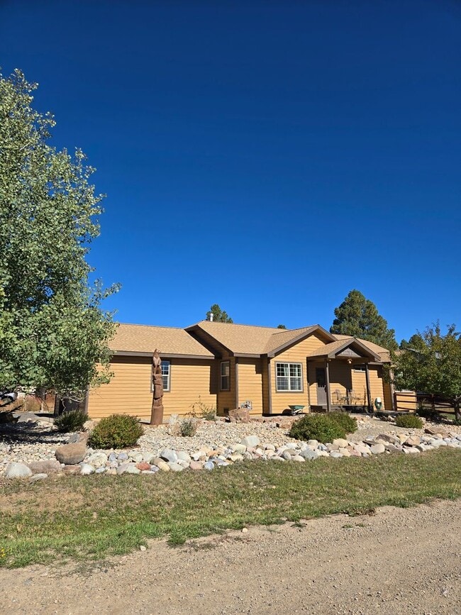 Building Photo - Home on Woodsman