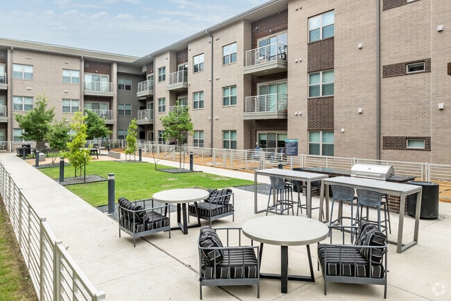 Expansive Outdoor Kitchen with Multiple Seating Areas
