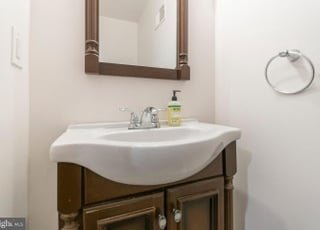 Half bath located on first floor is perfect for guests.