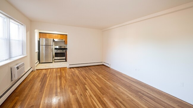 Step into the modern elegance of Dorchester House Apartments. This spacious layout boasts gleaming hardwood floors and a fully equipped kitchen, perfect for your culinary adventures. Explore your new home today! - Dorchester House