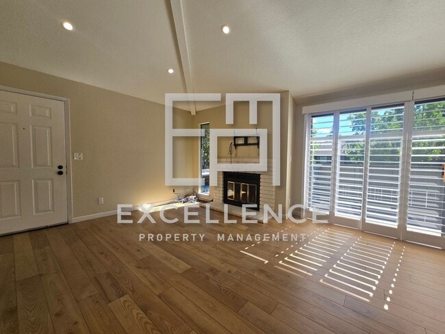 Photo - 1/1 Condo with Vaulted Ceilings, Community Pool, Parking, Fireplace and Updated Throughout!