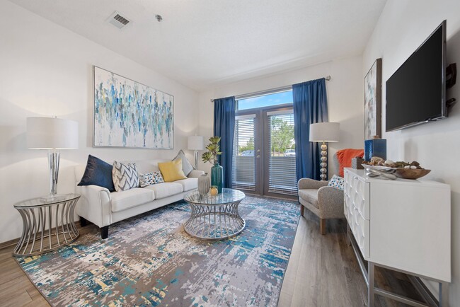 Charming Living Room with Hardwood-Style Flooring - Brunswick Point Apartments