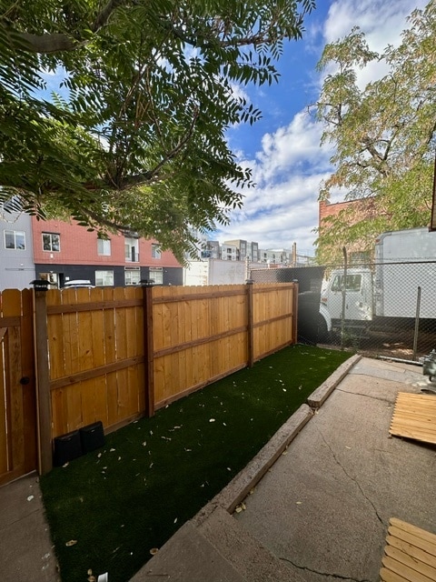 Small astroturf patio behind mural; front entrance from Walnut St. - 2748 Walnut St Unit A