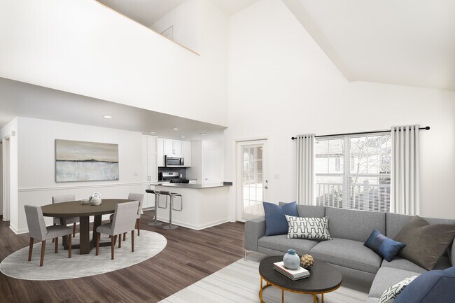 Kitchen, living, and dining areas with hard-surface flooring