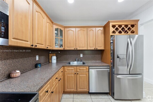 Building Photo - 7700 Camino Real Unit D-202 Rental