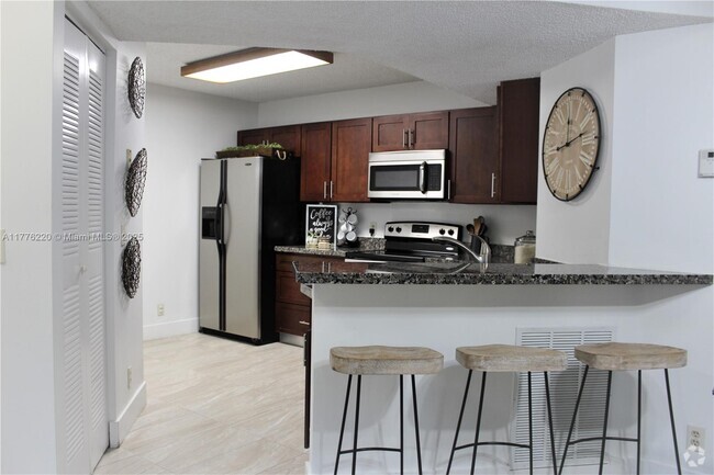Building Photo - 8871 Wiles Rd Unit 205 Rental