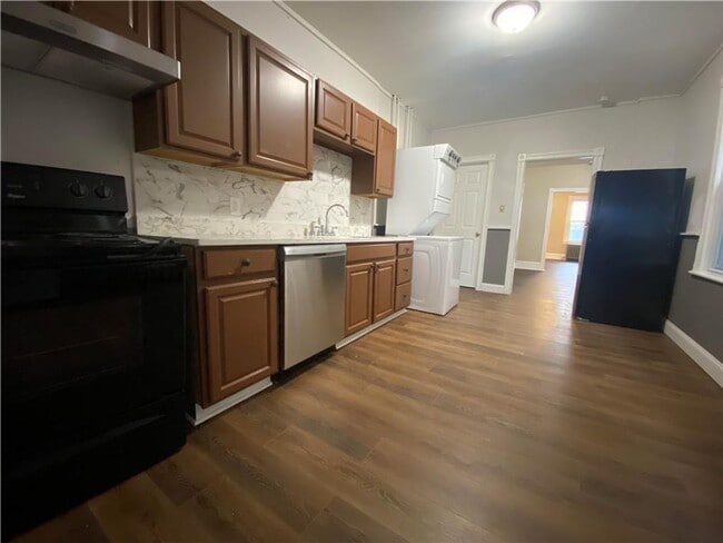 Photo - Charming three-bedroom row house available...