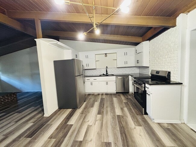 Photo - Quirky Mid-Century 3BR with High Beam Ceilings + Fenced Yard – $1,550