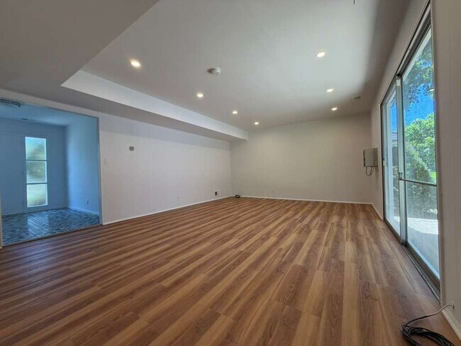 Photo - Spacious 4-Bedroom Home with Functional Layout, Backyard Access & Attached Garage