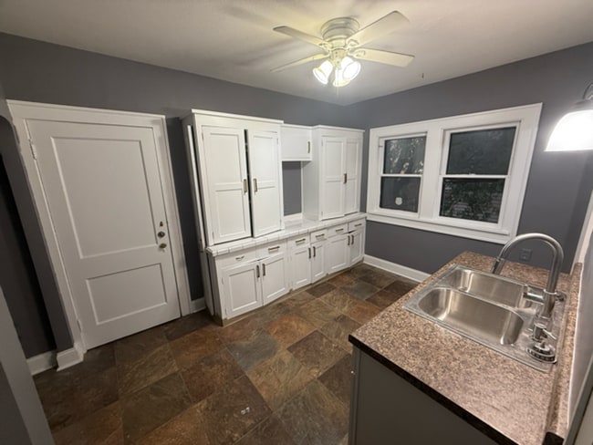 Photo - ? Updated 4BR/2BA Single-Family Home — Garage Parking, Water & Lawn Care Included ?