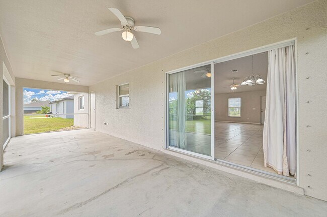 Photo - Spacious Three-Bedroom Home with Open Floor Plan, Large Yard & Screened Patio