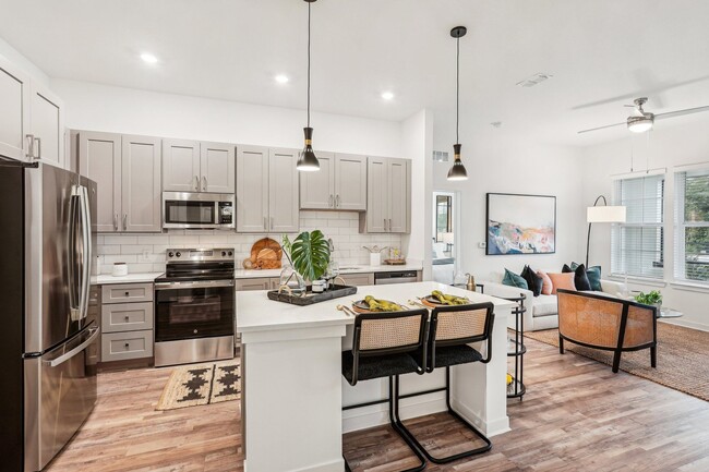 Enjoy your new kitchen with ample storage, beautiful lighting and well designed finishes - Tapestry University Park Apartments
