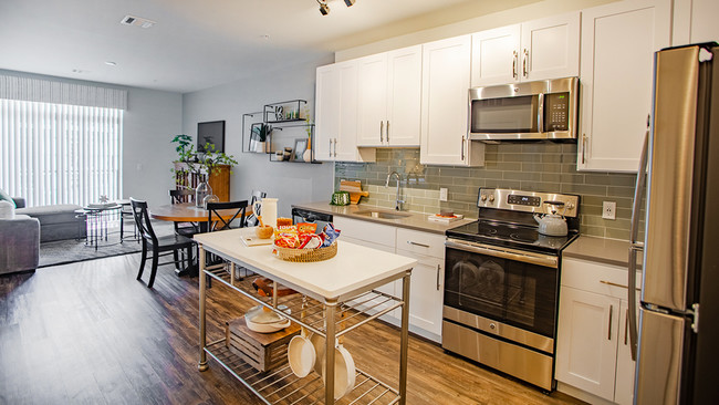 Sustainable wood plank-style flooring throughout