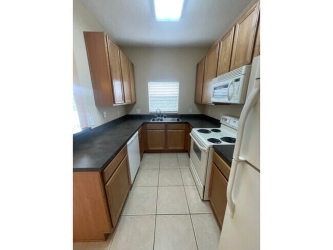 Photo - Spacious Gated Townhouse with Garage, Community Pool, and More!