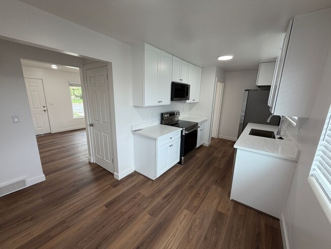 Building Photo - Remodeled 4 Bed, 2 Bath with Double Kitchen & Covered Carport