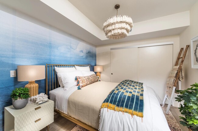 Primary bedroom featuring expansive closet space and spa-inspired bathroom access.