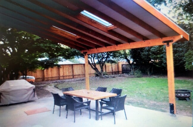 Large fenced in backyard with covered patio and dog door to the kitchen - 5252 NE 49th Ave Condo