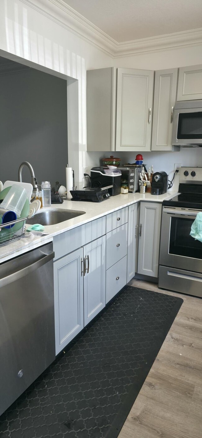 Building Photo - 6091 NW 61st Ave Unit 105