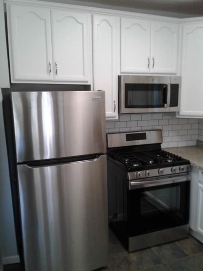 Photo - Beautiful 3 bed / 1 bath home on corner lot with attached garage in quiet Sparta neighborhood!