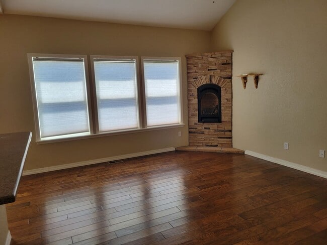 Photo - 4 Bed 3 Bath home with A/C and a gas fireplace, Available 5/8! - MileStone Real Estate Services