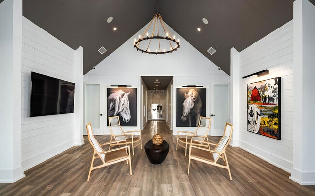 A vaulted hall and four chairs, adding one more room here to gather in.
