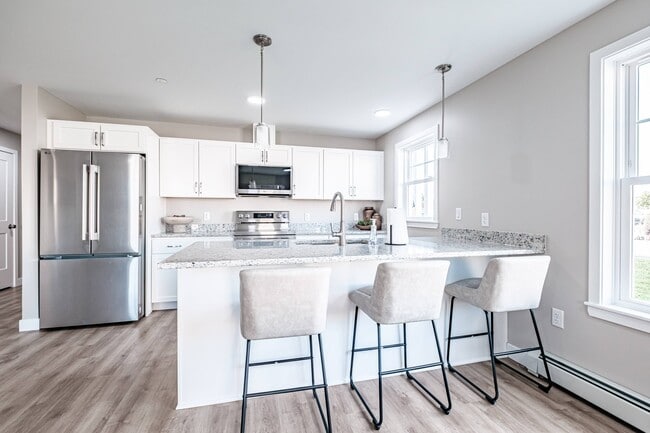 The heart of the home, this modern kitchen offers sleek stainless steel appliances, generous counter space, and a large island perfect for dining, entertaining, and everyday living.