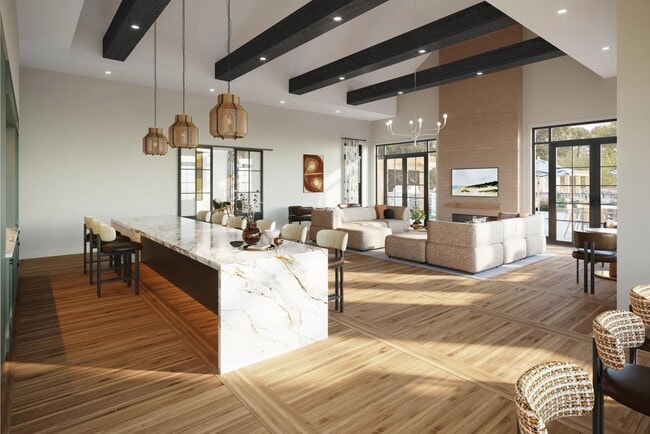 Expansive clubroom with gathering space, catering kitchen, indoor/outdoor fireplace, and lounge seating near Boston, MA. - Modera South Shore