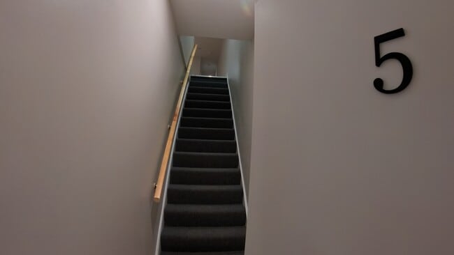 Staircase from front entrance up to apartment - 4646 York Rd