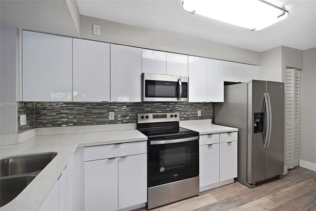 Building Photo - 18840 NW 57th Ave Unit 306