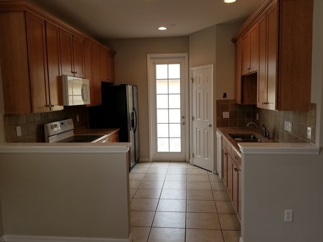 Photo - Morningside at Lake Nona End Unit Townhome with Two Car Garage