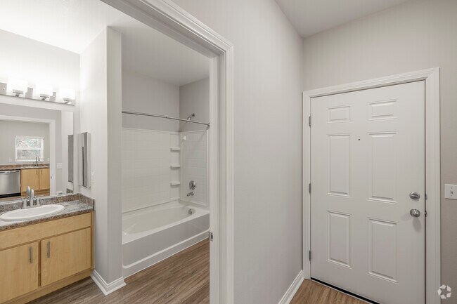 The Elm - Bathroom *Studio - 678SF - Bathroom/Entrance - Woodland Apartments