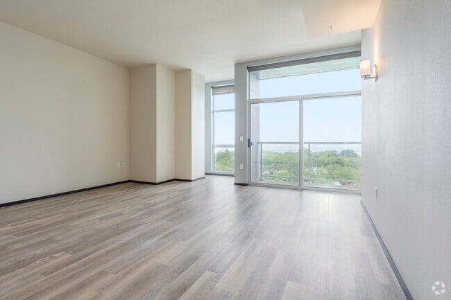 0BR, 1BA - 802SF - Living Room - Galaxie High Rise Apartments