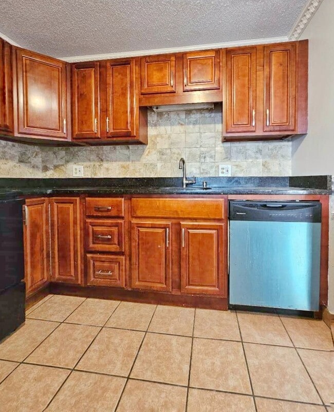 Photo - Beautiful renovated 3 bed 2 bath townhouse with deeded parking and easy Highway access