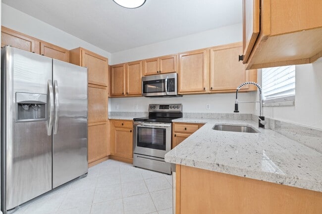 Photo - "Charming 3-Bed Townhouse with Granite Elegance in Ruskin - 1366 Sq Ft of Comfort!"
