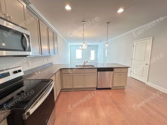 Photo - Spacious 3 Bed, 2.5 Bath Home with Modern Amenities / Available Soon!