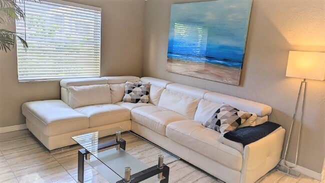 living room with new furnishings - 496 28th Ave N Unit 1